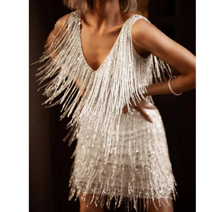 Sleeveless sequin fringe tiered mini dress for women, with a dazzling V-neckline. Ideal cocktail wear.
