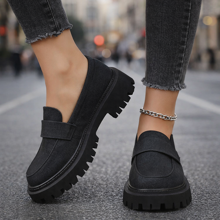 Side view of women's denim platform loafers, highlighting the comfortable platform and slip-on style