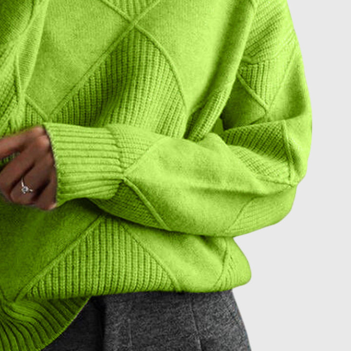 Stylish diagonal seam detail on a women's roll neck winter sweater, for cozy elegant fashion.