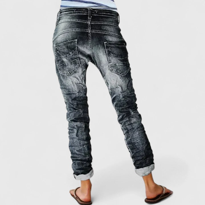 Women's distressed wide leg jeans with a relaxed vintage fit, perfect for casual wear. Comfortable denim.