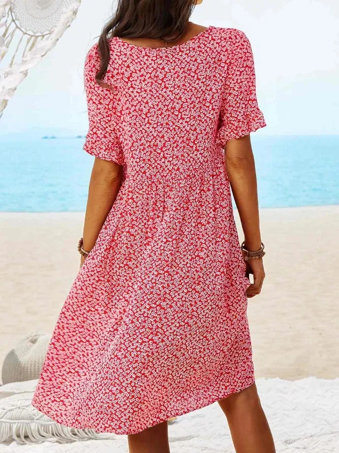 Chic women's ditsy floral mini dress with flutter sleeves, ideal for summer vacation or beach outfit.
