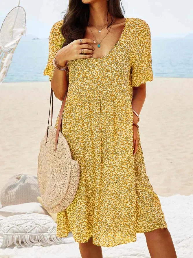 Light & airy women's summer mini dress, ditsy floral print with flattering flutter sleeves for daywear.