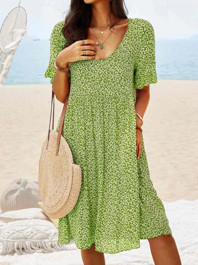 Casual women's ditsy floral mini dress with flutter sleeves, great for spring, summer, or vacation style.