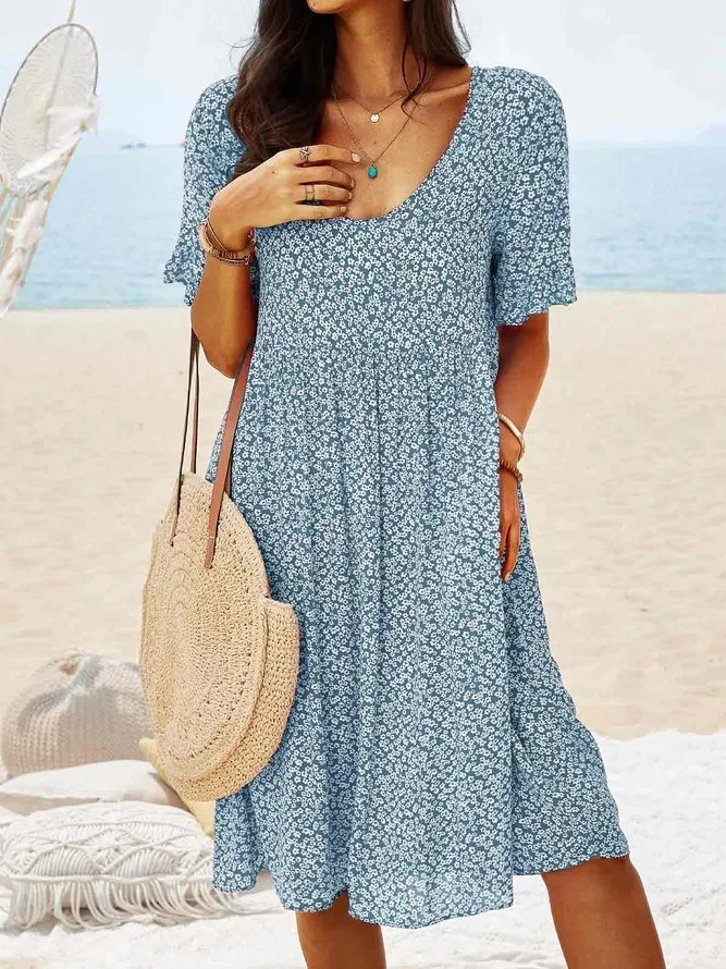 Stylish women's ditsy floral mini dress, short flutter sleeves, perfect spring & summer daywear outfit.