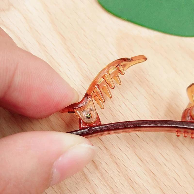 Close-up of a black double bangs hair clip headband, perfect for women's hair styling