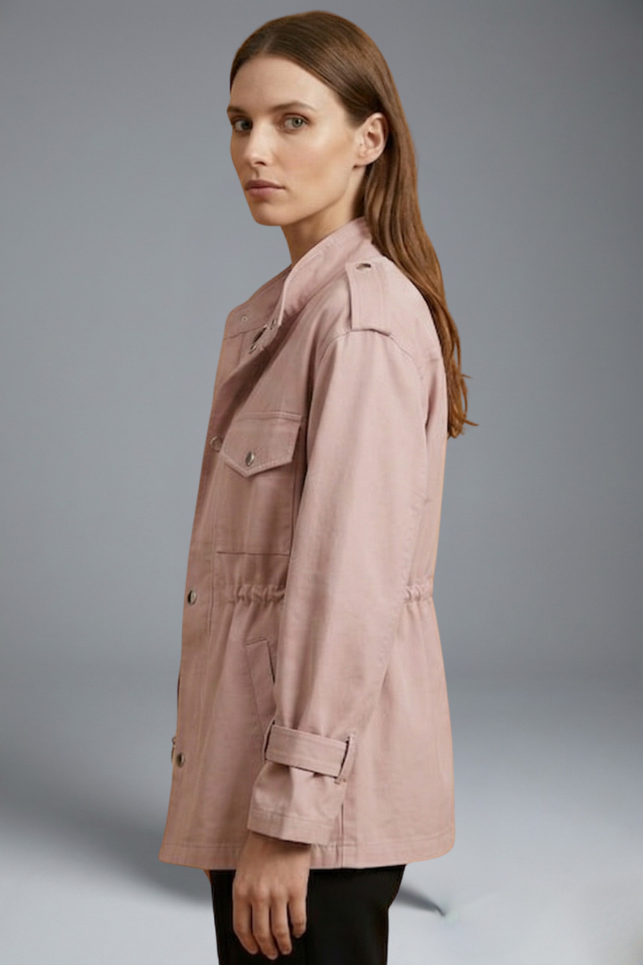 Tailored women's utility jacket featuring double-breasted closure and belt, modern spring outerwear.