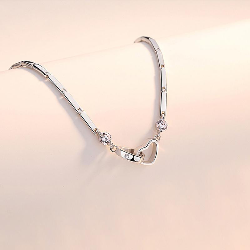 Fashionable women's bracelet, sterling silver double heart design with brilliant crystals, a must-have accessory.