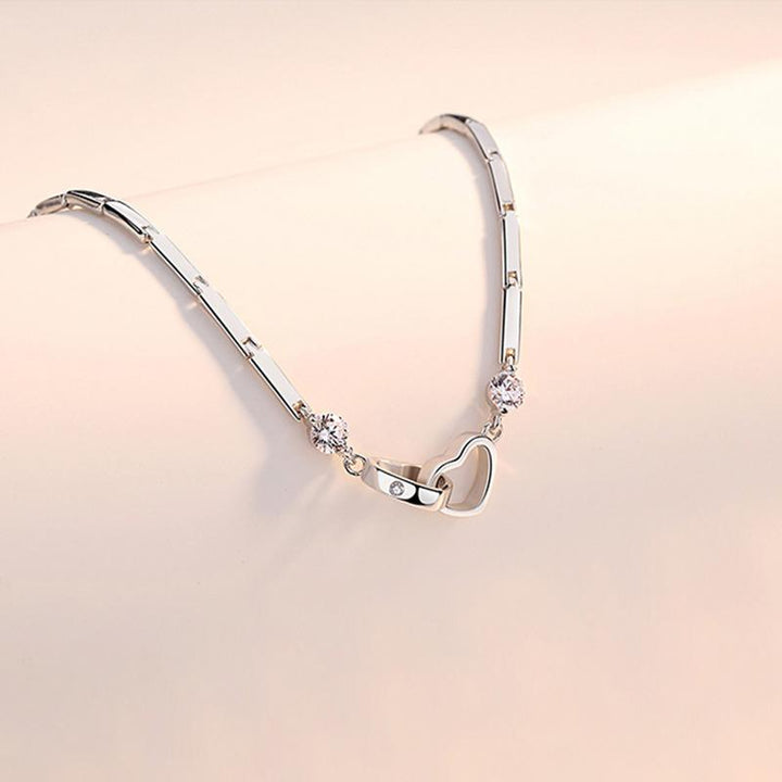 Fashionable women's bracelet, sterling silver double heart design with brilliant crystals, a must-have accessory.