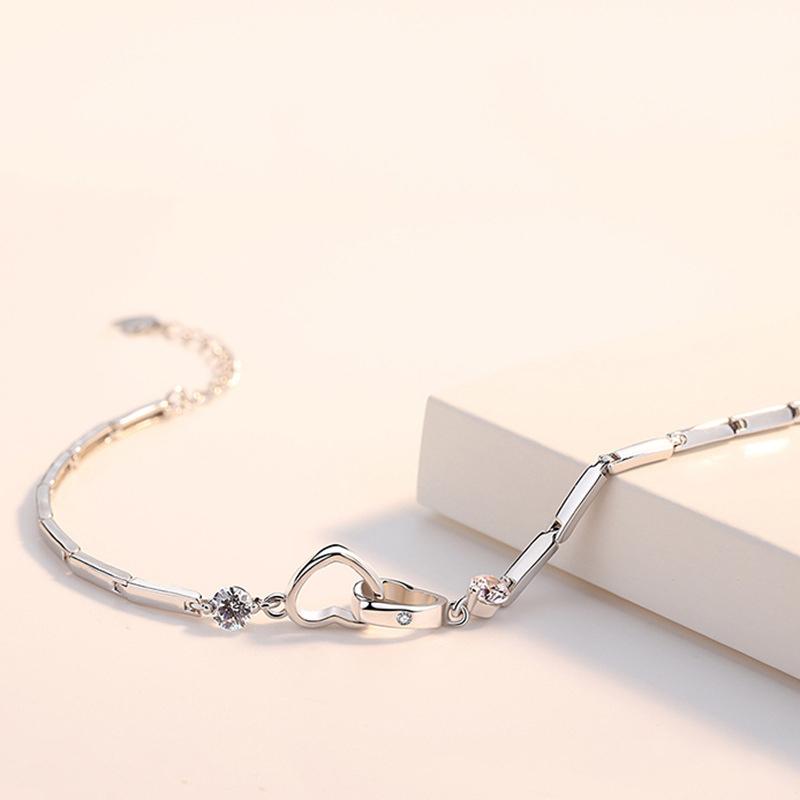 Double heart link bracelet for women, sterling silver with clear crystal accents, an elegant and romantic jewelry gift.