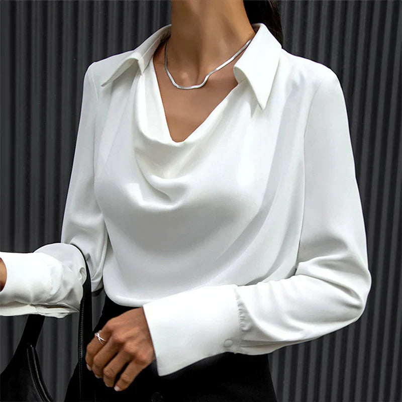 Model wearing a white drape neck long sleeve satin blouse, ideal for both formal and casual settings.