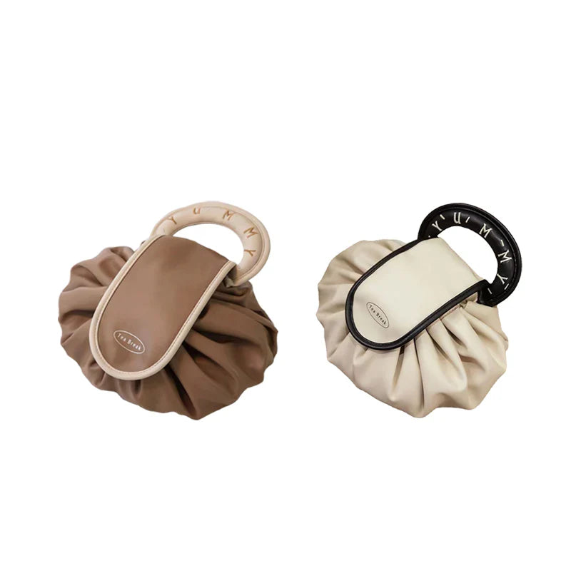 Close-up of the drawstring mechanism on the women's faux leather organizer handbag