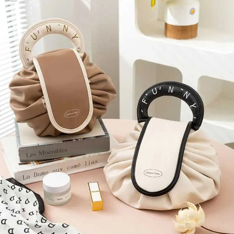 Stylish women's travel organizer handbag open, showing spacious interior for makeup