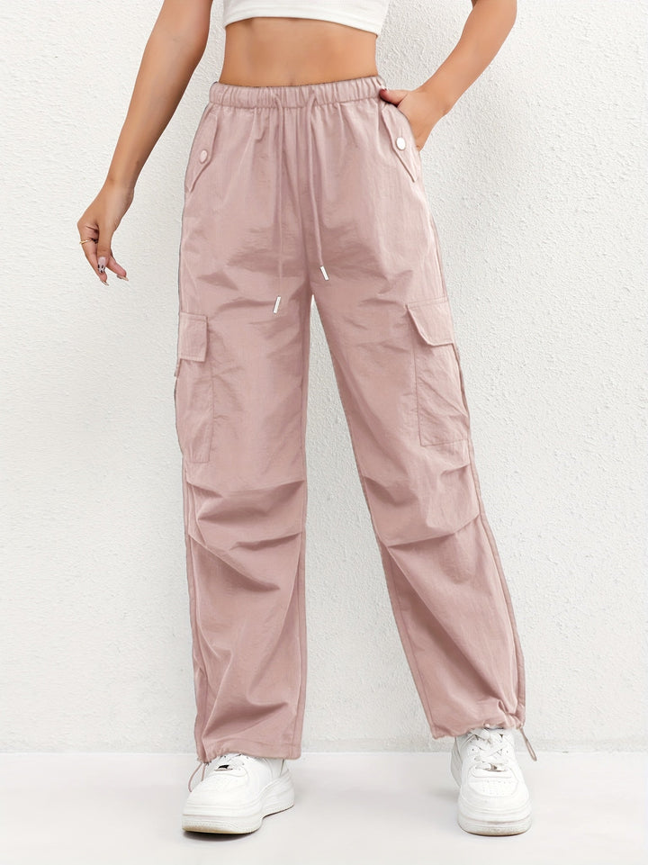 Women's drawstring waist cargo parachute pants in a relaxed fit, perfect for trendy street style and casual wear.
