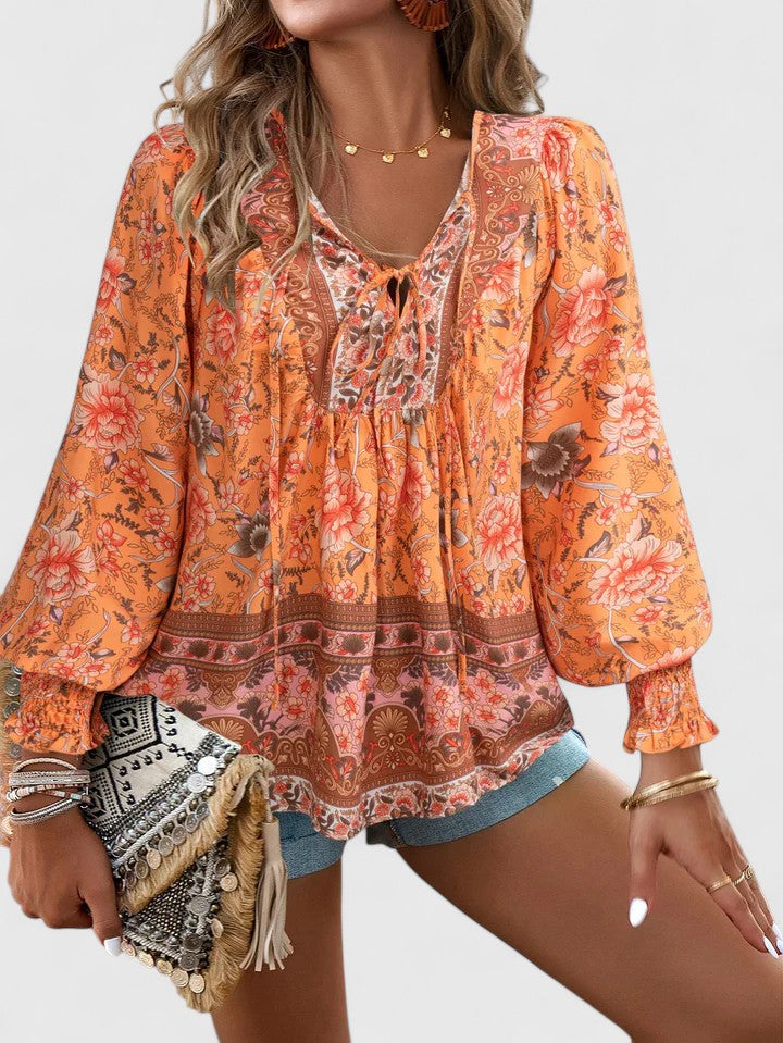 Stylish women's floral long sleeve blouse, embodying a dreamy boho peasant aesthetic.