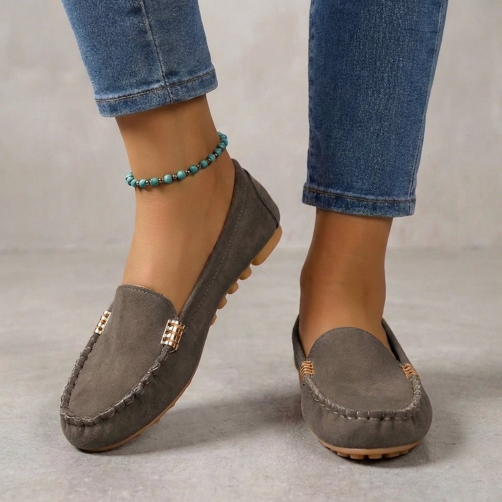 Casual women's slip-on moccasin loafers featuring a supportive orthopedic sole & metallic accent.