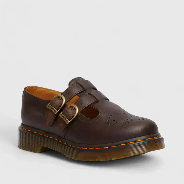 Stylish women's Mary Jane flats with prominent double buckles, perfect for edgy grunge fashion.
