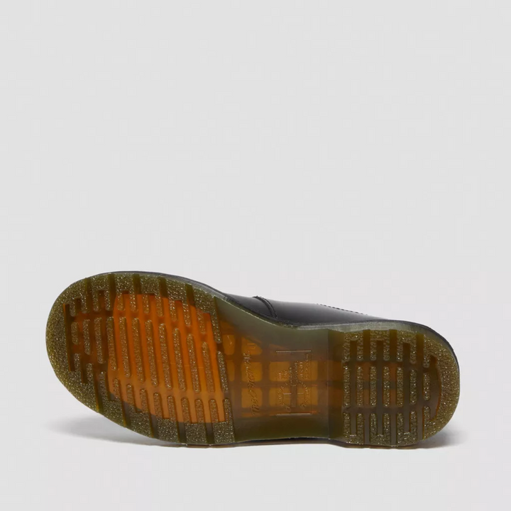 Close-up of women's edgy double buckle Mary Jane flats, highlighting their unique design & straps.