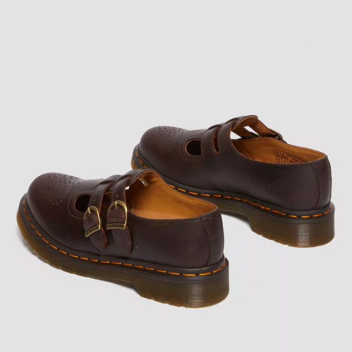 Model wears edgy women's double buckle Mary Jane flats, styled for a modern grunge fashion look.