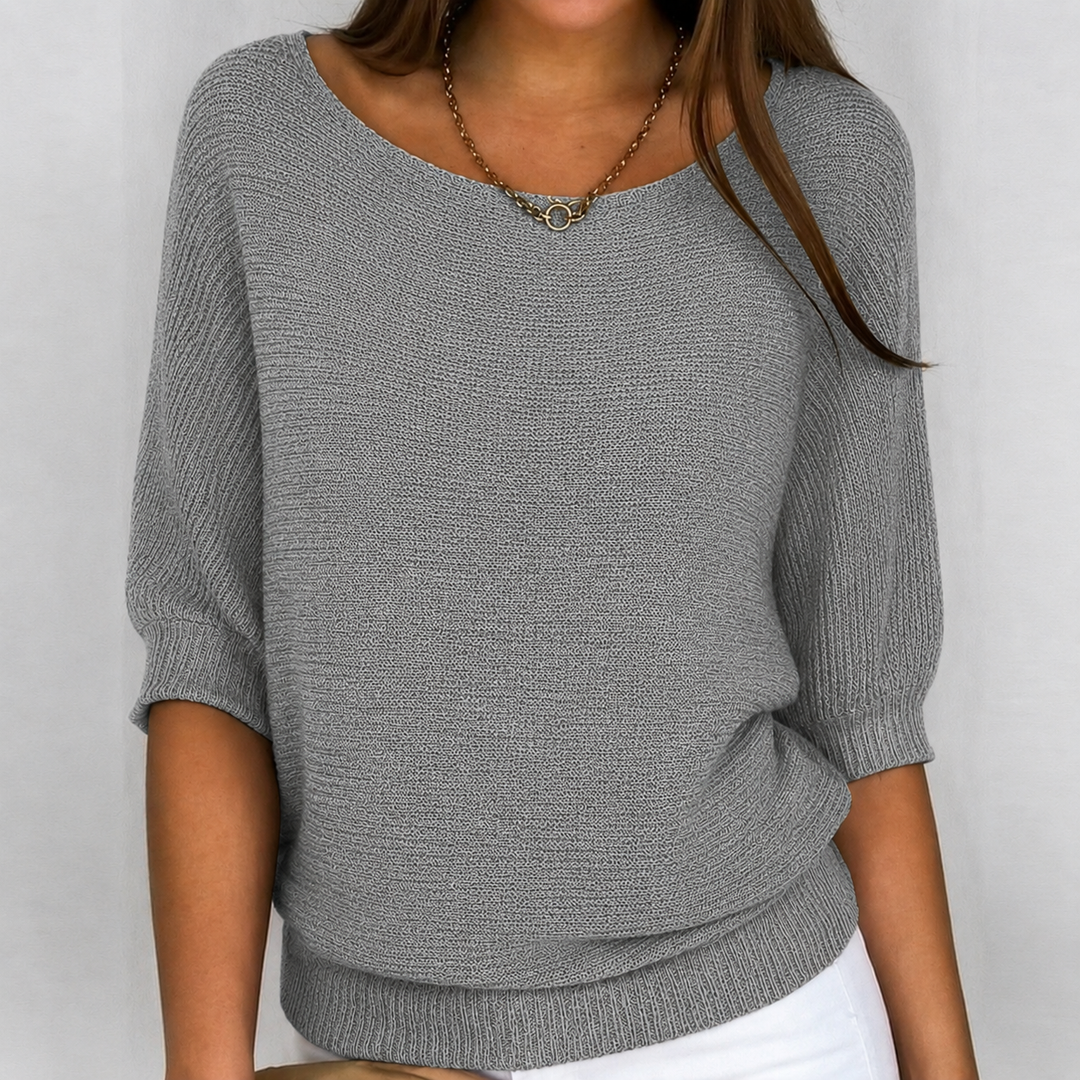 Women's effortless 3/4 sleeve knit sweater. Soft, oversized, and comfortable for everyday casual wear.