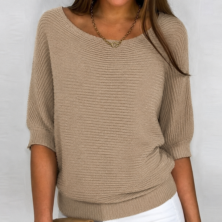 Comfortable women's knit sweater with 3/4 sleeves. Features an oversized, relaxed fit for all-day comfort.