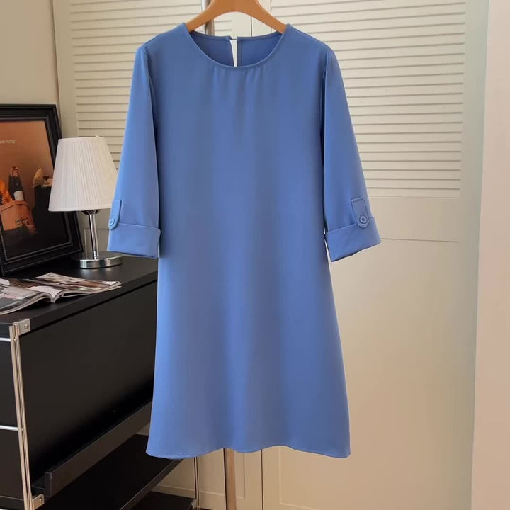 Versatile women's comfort dress. Elegant midi length, rounded neck, 3/4 sleeves. Ideal for autumn casual or office.