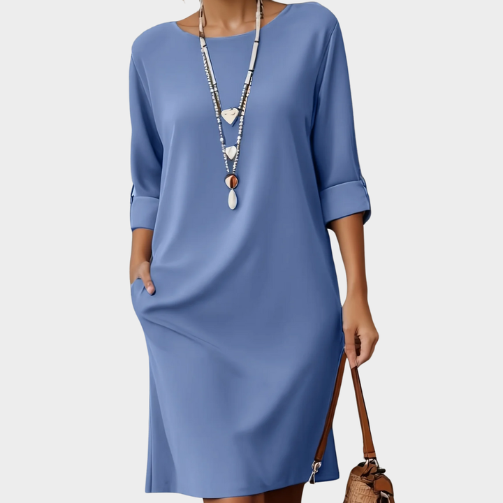 Versatile women's comfort dress. Midi length, rounded neck, 3/4 sleeves. Perfect for office attire or casual outings.