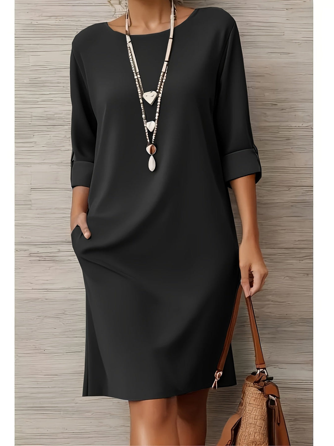 Autumn style women's midi dress with a rounded neck and 3/4 sleeves. Combines effortless comfort & elegant design.