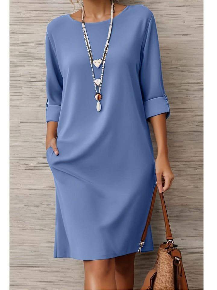 Flattering women's midi dress. All-day comfort shift dress for versatile fashion, featuring 3/4 sleeves.