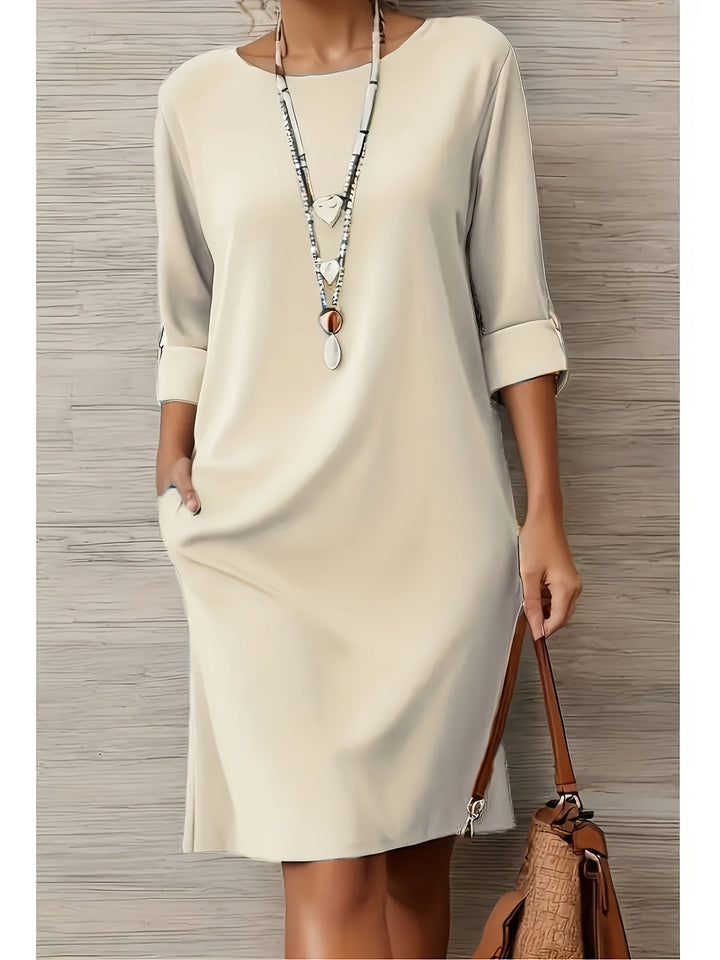 Everyday wear women's casual dress. Comfortable midi style with a rounded neck, 3/4 sleeves, and an elegant fit.