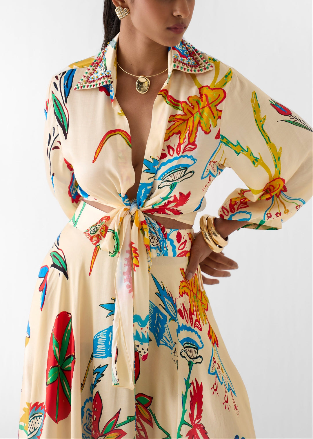 Close-up of women's beige floral tie-front shirt, part of an effortless two-piece matching set.