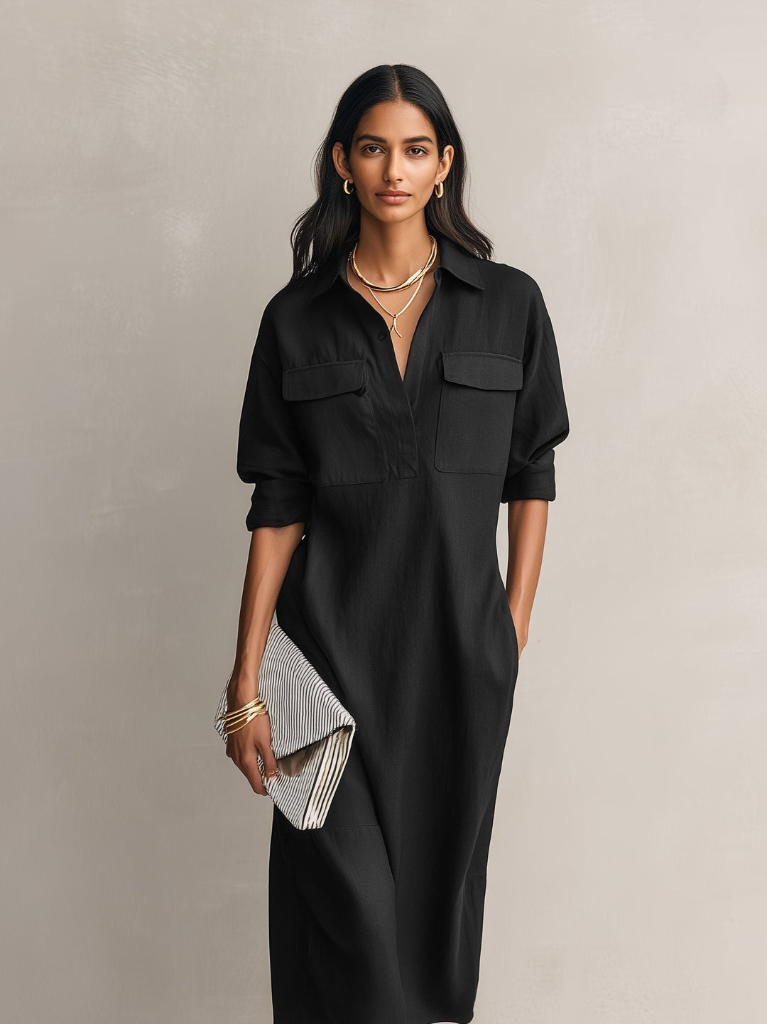 Chic women's black midi shirt dress, collared, with elbow sleeves. Versatile for elegant spring, summer, or office style.