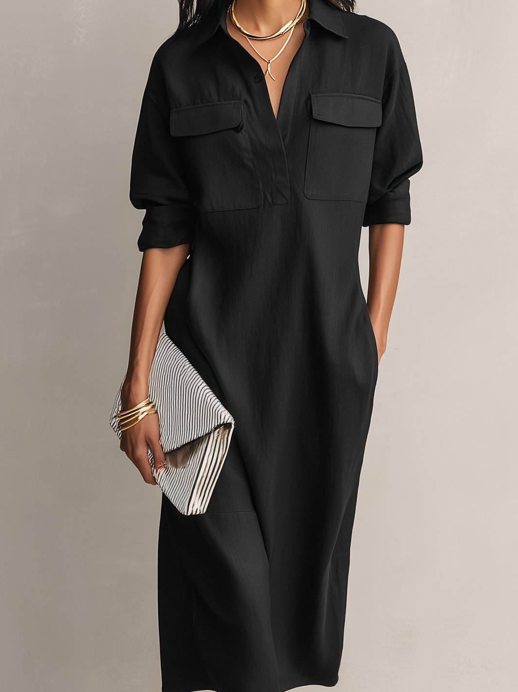 Elegant black collared midi shirt dress for women. Effortless style with elbow sleeves, suitable for versatile casual to office looks.