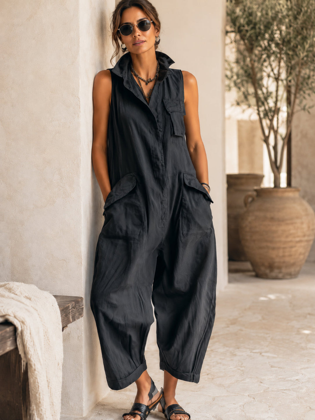 Comfortable women's black jumpsuit, sleeveless with a smart collar & flowy wide legs. Great for everyday chic.