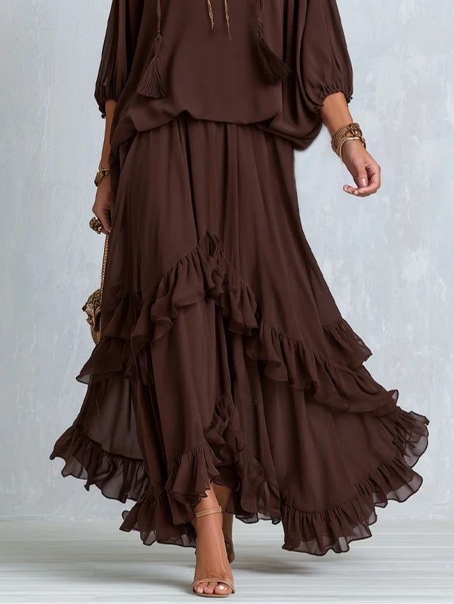 Versatile women's brown wrap maxi dress, showcasing a V-neckline and a beautiful tiered ruffle hem. Autumn ready.