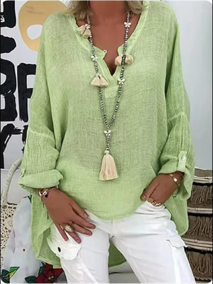 Casual elegant women's oversized blouse, a comfortable and stylish tunic shirt suitable for various summer outfits.