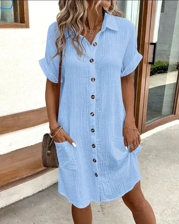 Closeup of pockets & buttons on a women's casual polo midi dress. Comfortable, stylish, effortless summer wear.
