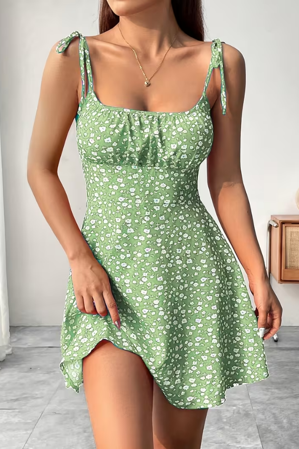 Elegant women's mini slip dress featuring a vibrant floral print and a comfortable strapless design for summer.