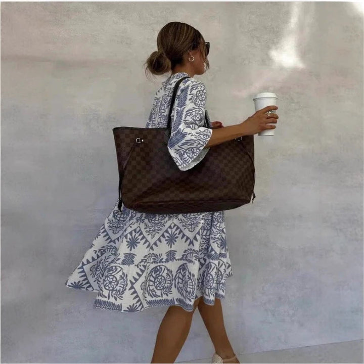 Flowy tiered boho sundress for women, featuring a beautiful floral print, perfect as a tunic or casual dress.