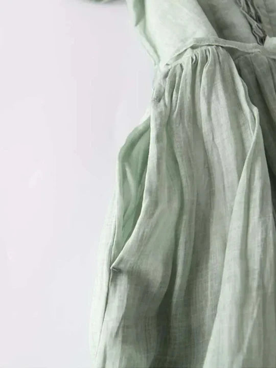 Comfortable women's flowy summer dress. Airy sleeveless midi style for casual wear, spring outings, or elegant vacations.