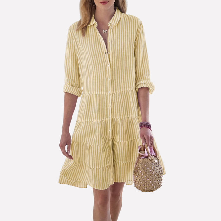 Close-up of soft fabric on a women's flowy summer midi dress, comfortable and breathable for warm weather.