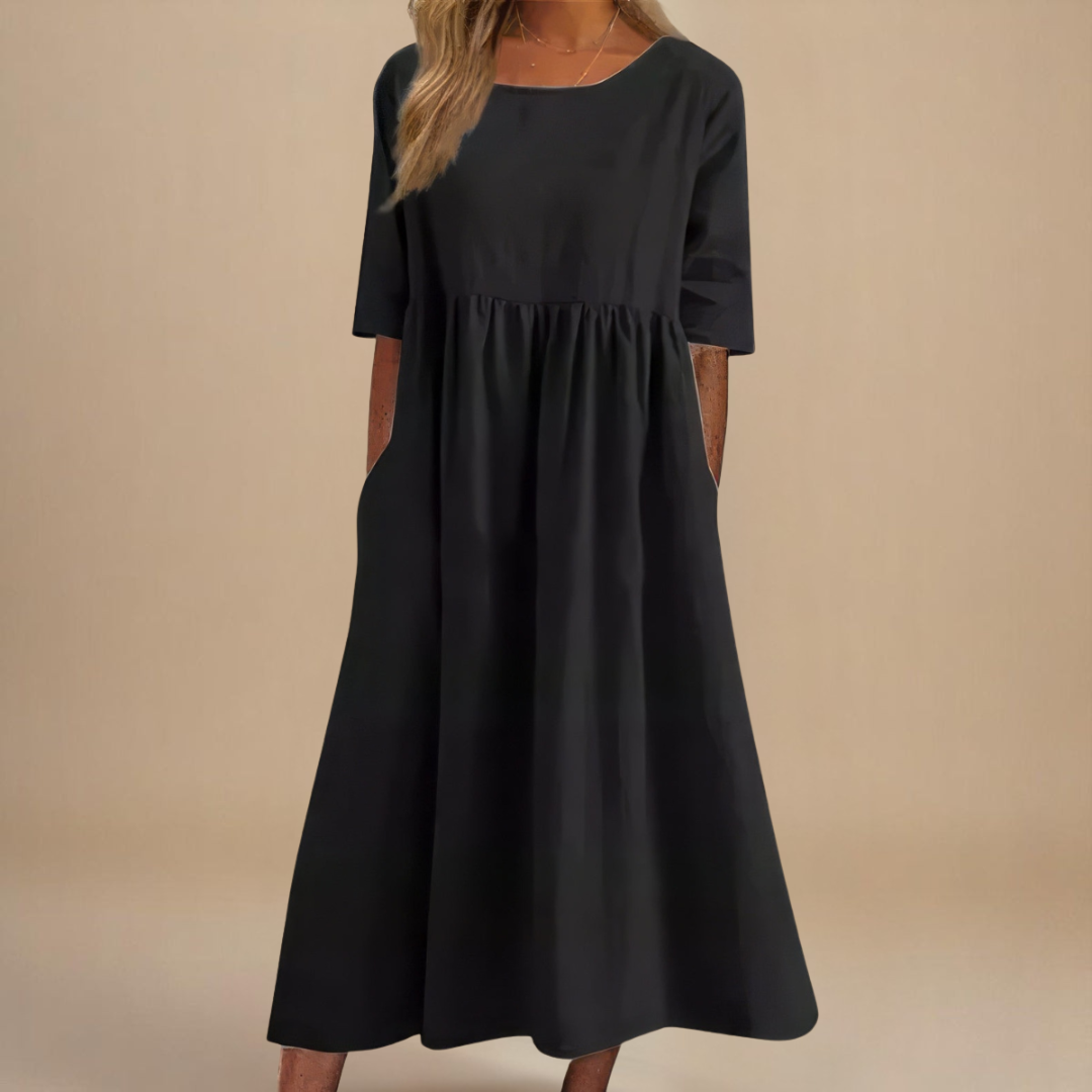 Everyday women's summer midi dress featuring a comfortable gathered waist, scoop neck, and half sleeves.