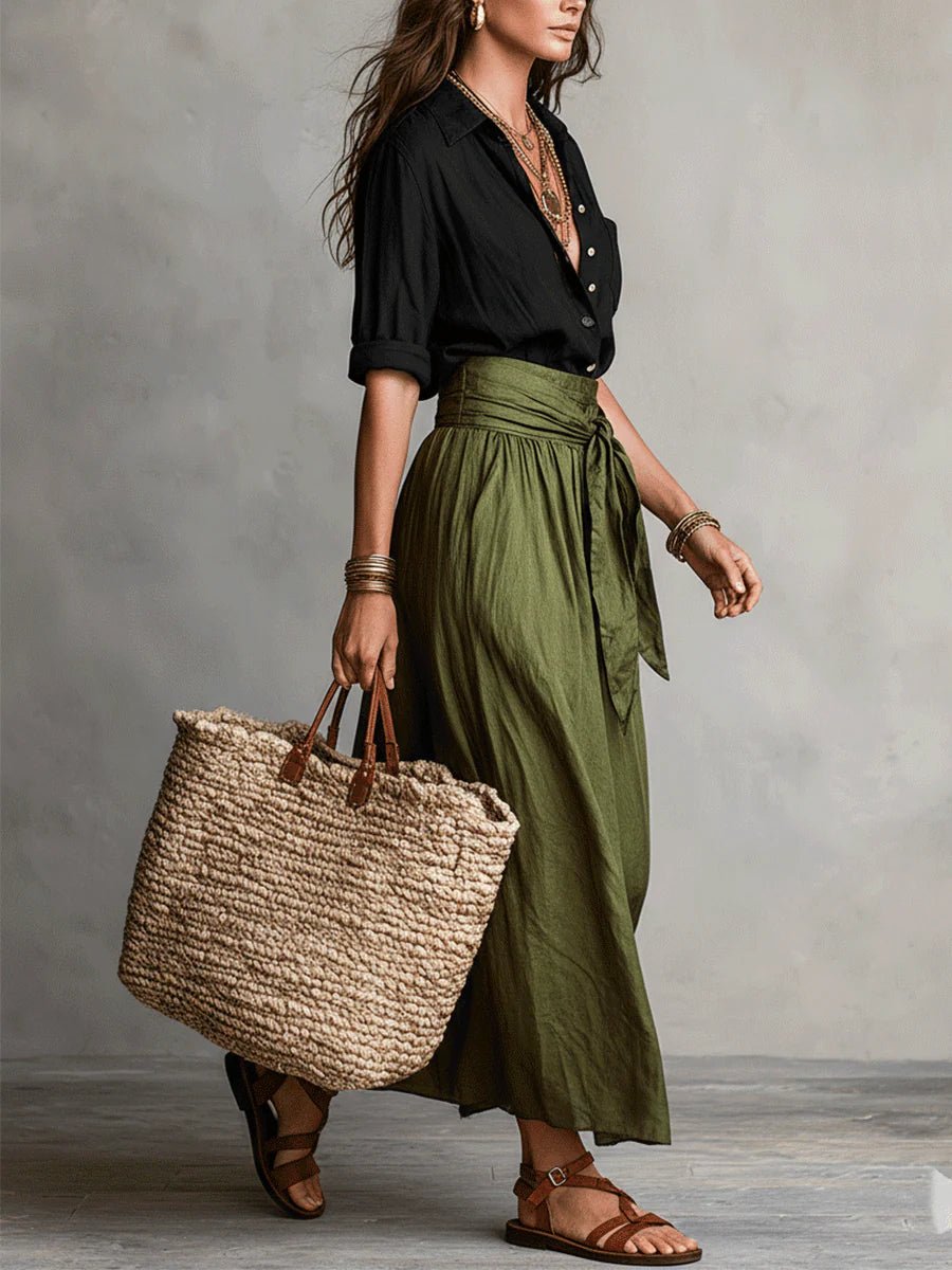 Chic women's two-piece maxi skirt set, featuring a button-front top & tie-waist for a relaxed, casual summer look.