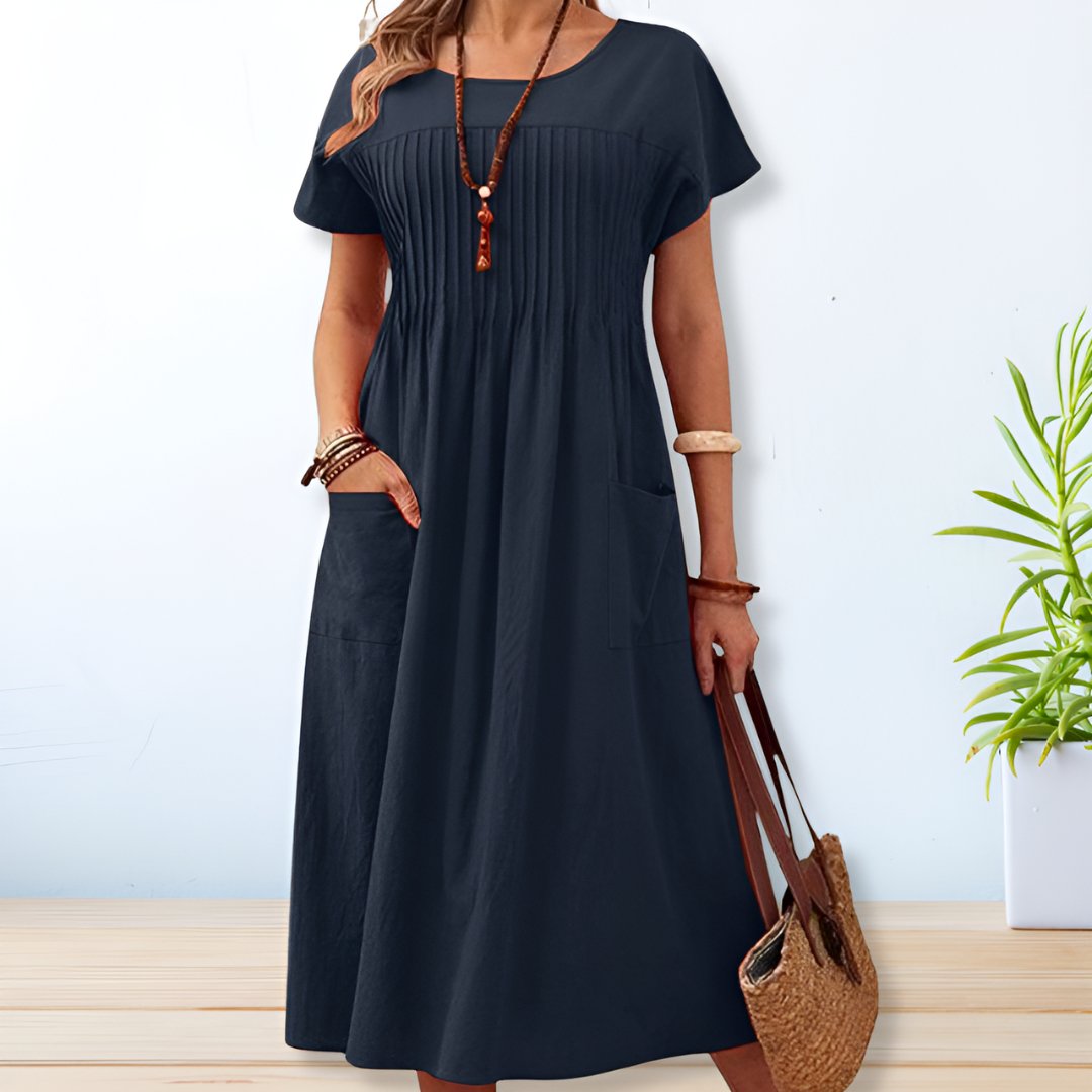 Comfortable women's relaxed fit pleated midi dress. Ideal for casual everyday spring & summer style.