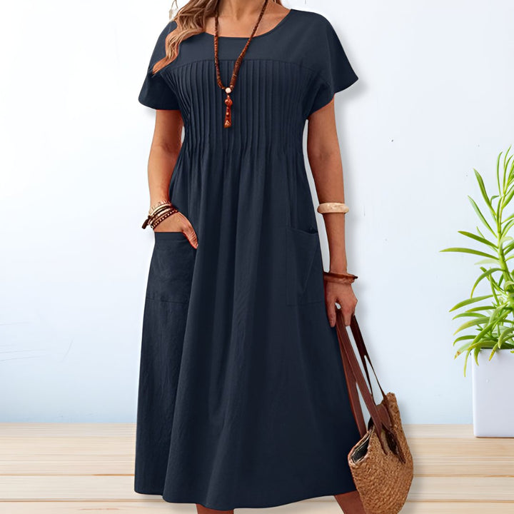 Comfortable women's relaxed fit pleated midi dress. Ideal for casual everyday spring & summer style.