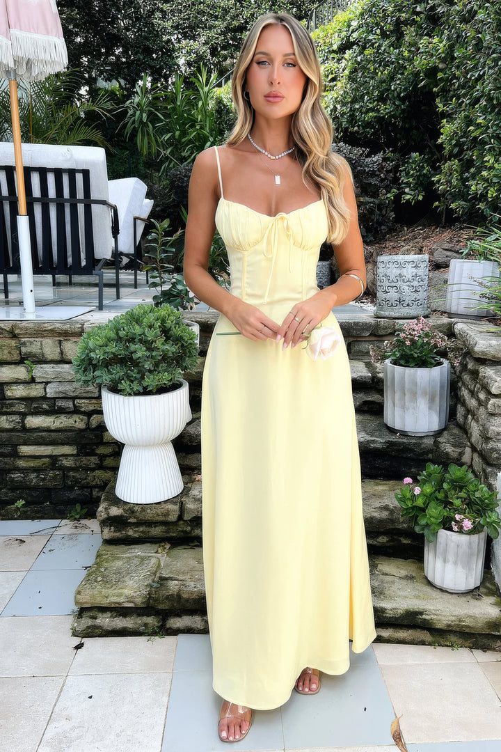 Women's sleeveless A-line maxi dress with tie-front detail, chic & casual summer style.
