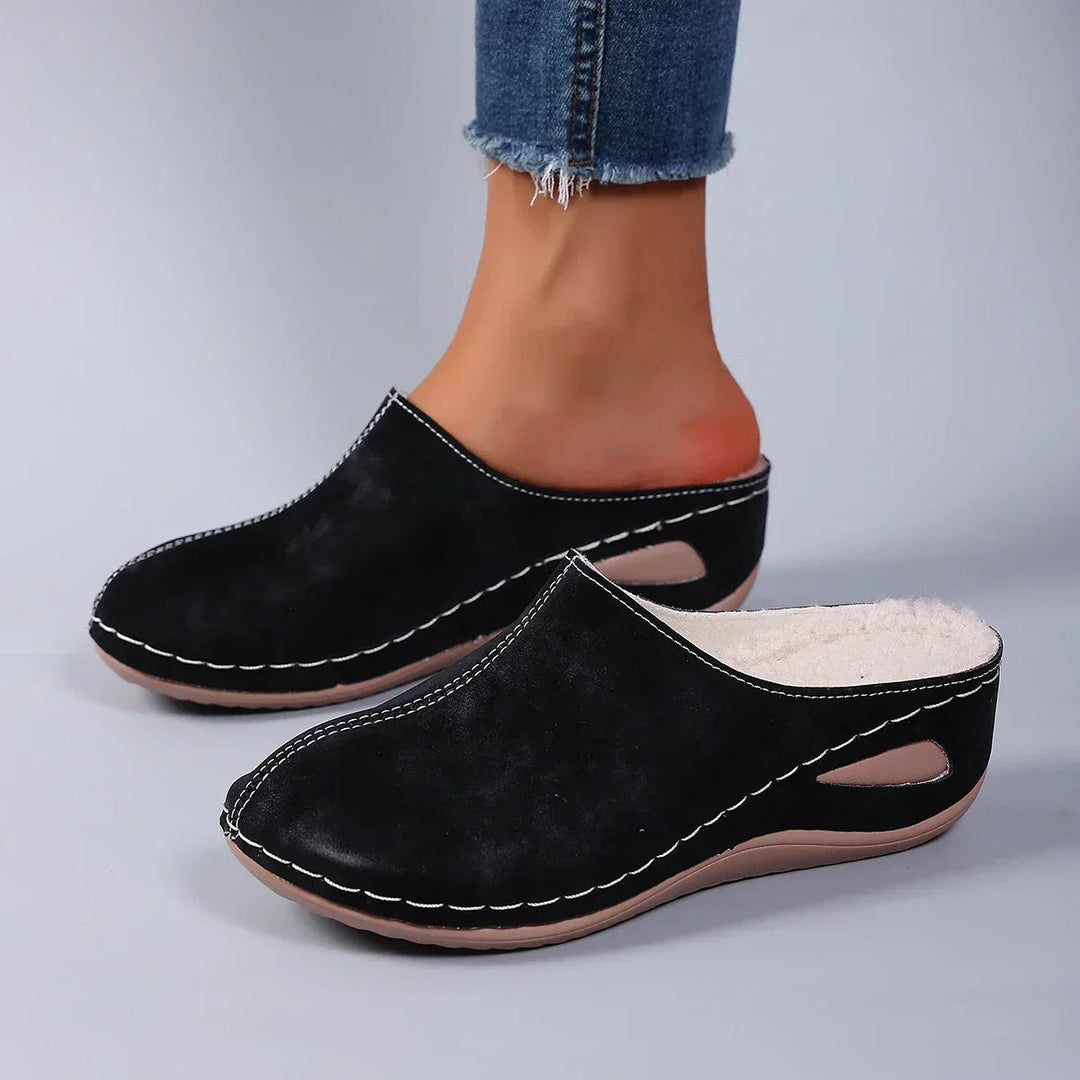 Cushioned women's comfort clogs, easy slip-on design ideal for walking & all-day wear.