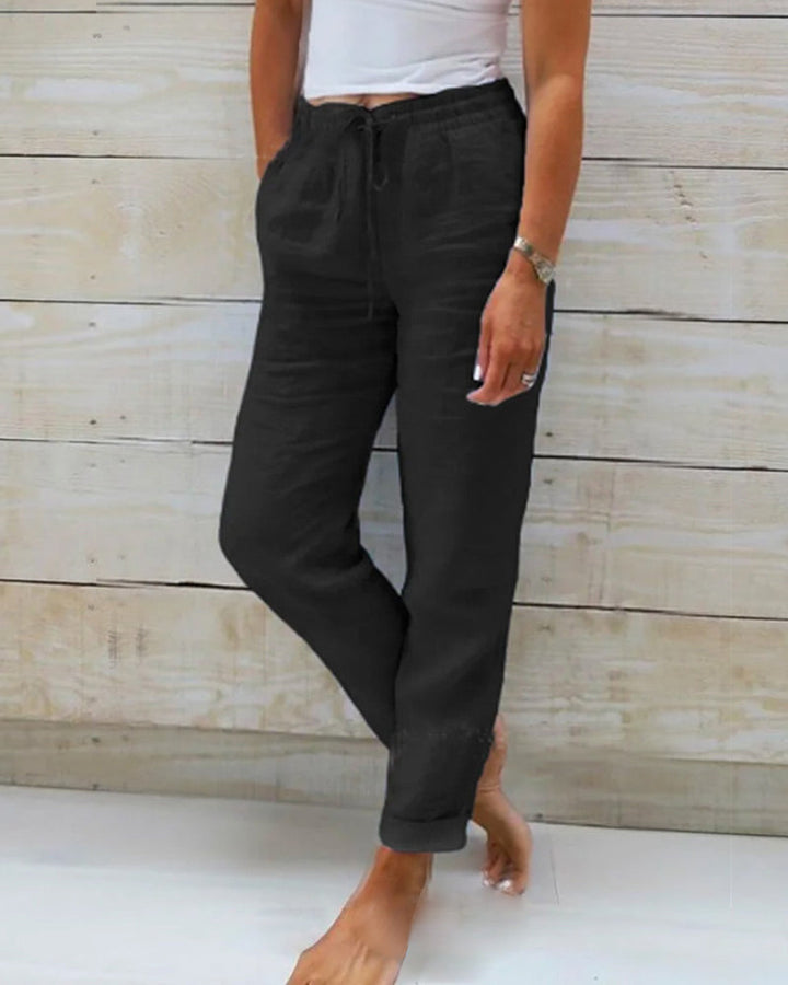 Relaxed fit women's drawstring pants with a straight leg. Perfect for travel, vacation, or casual summer days.