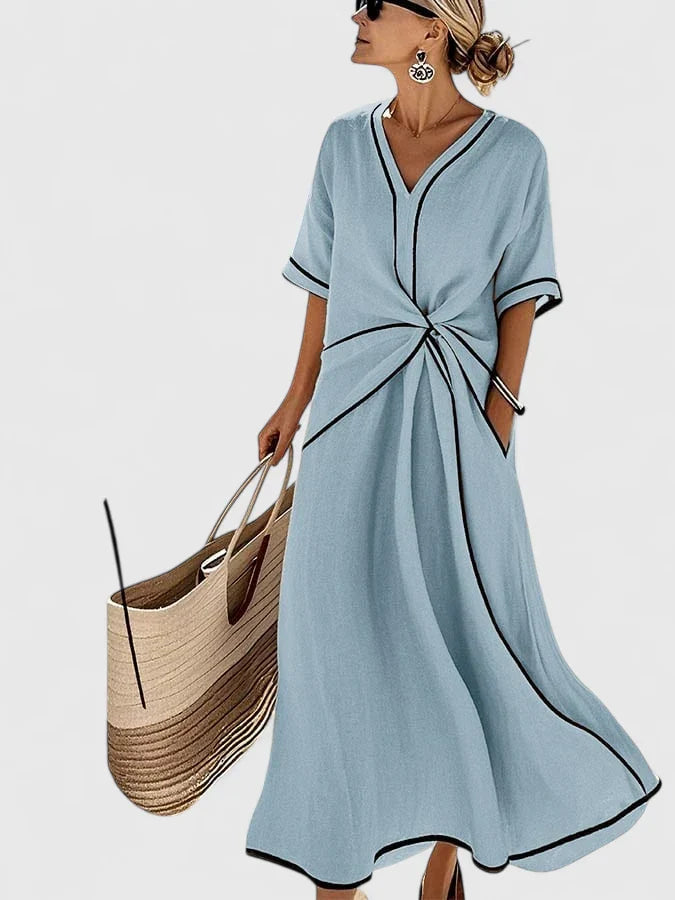 Elegant women's striped dress, perfect for a casual summer vacation outfit. Comfortable flowy midi style.