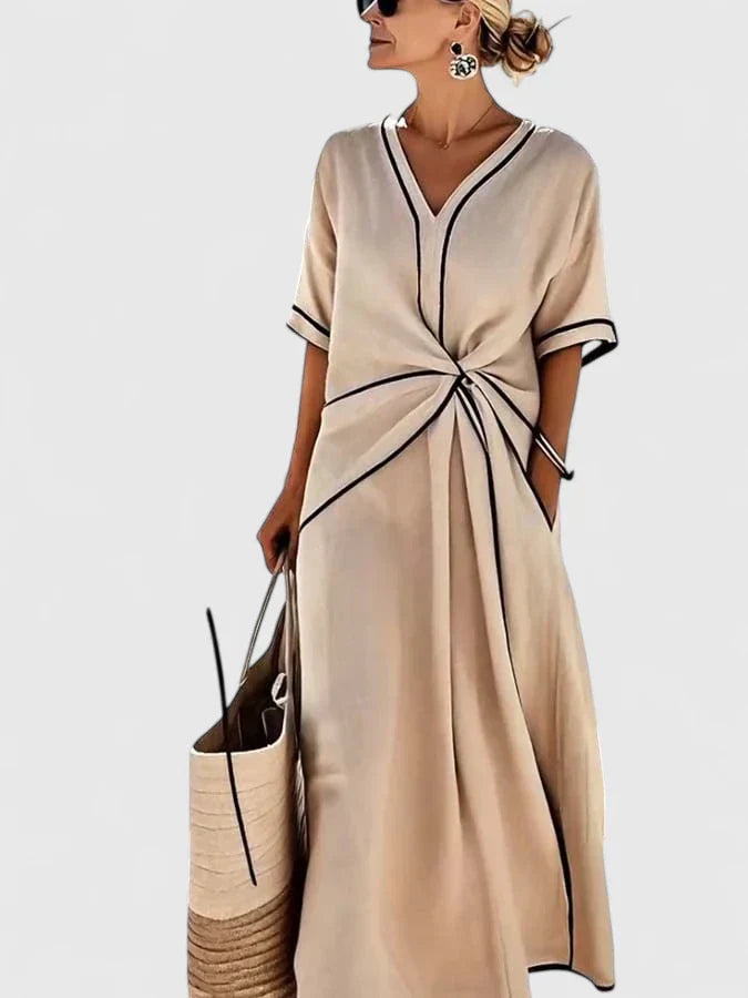 Stylish women's striped dress offering ultimate summer comfort. Versatile midi length for daily wear or vacations.