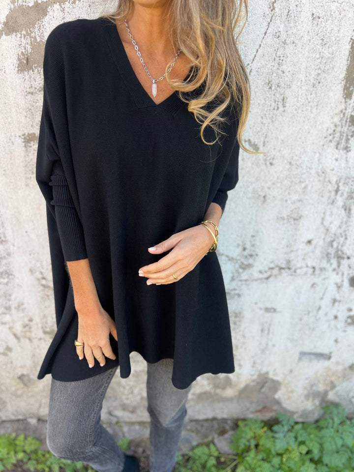 Women's Effortless Swing V-Neck Tunic Pullover sweater. Relaxed fit, long sleeve for casual, comfortable fashion.